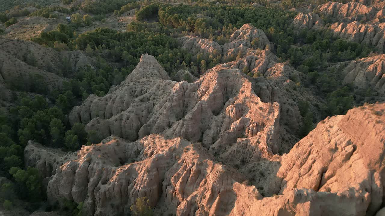 Geology. erosion effect. Ravine and gullies at sunset, aerial view. Badlands caused by severe erosion. Climate change and desertification. Viewpoint of the end of the world. Purullena. Granada. Spain