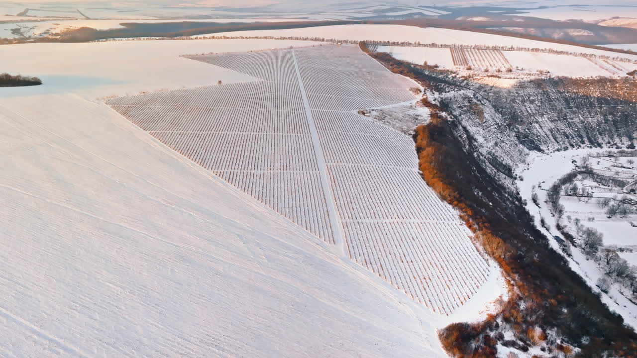 Aerial drone view of the Old Orhei covered in snow at sunrise. Fields during winter in Moldova