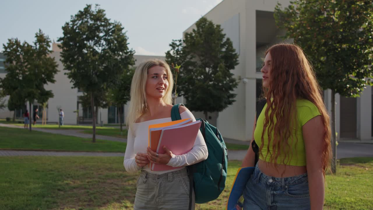 Two students walking on campus