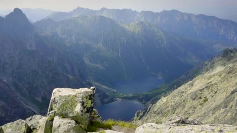 mountain peak view over small lakes in the far distance between beautiful mountains