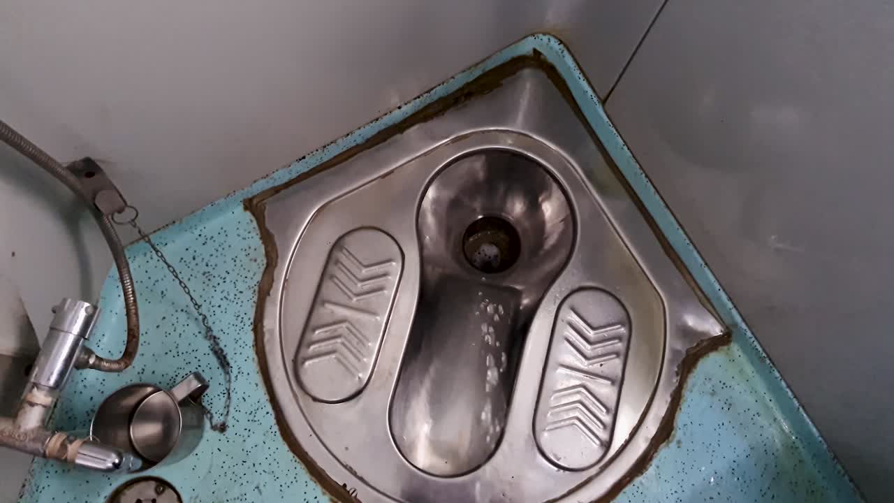 peeing at indian railway passenger train toilet from top angle video is taken at new delhi railway station on Aug 04 2022
