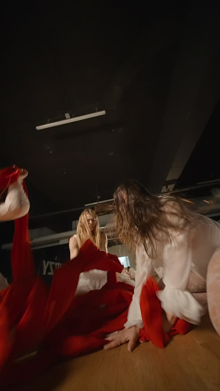 Contemporary Dance Performance with Red and White Costumes