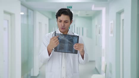 Happy-Indian-doctor-explaining-x-ray-report-to-patient
