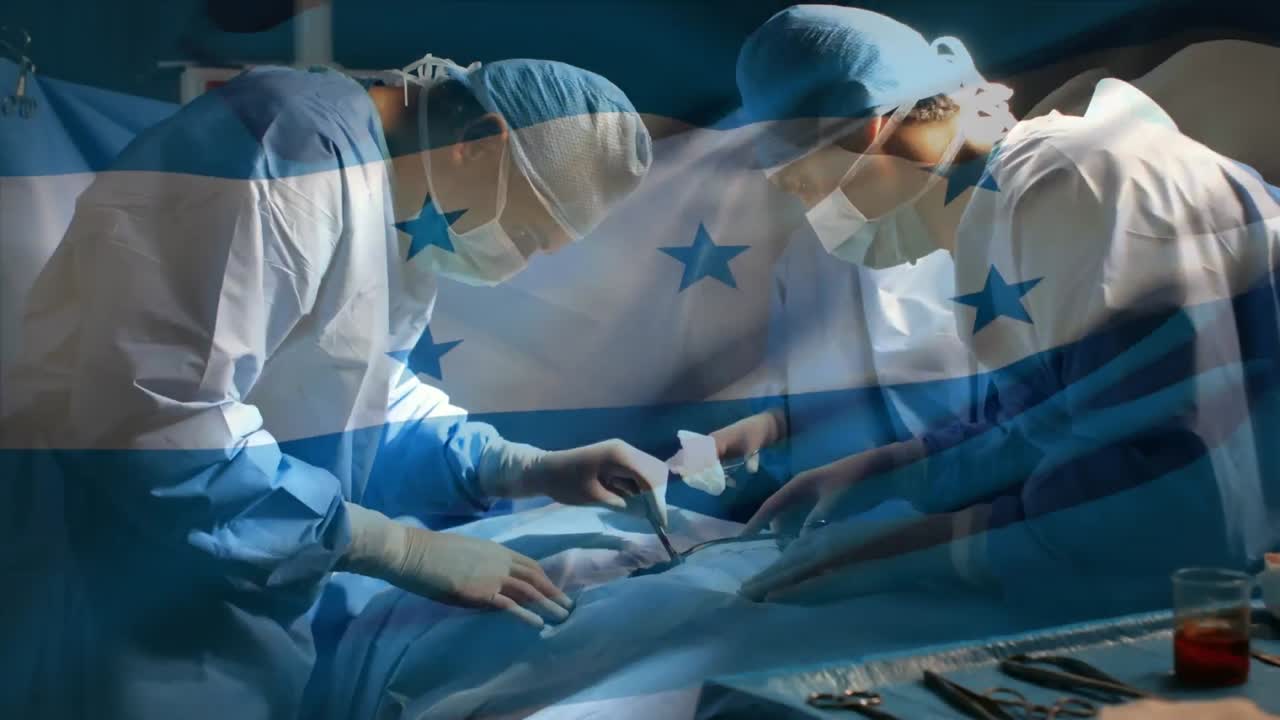 Animation of flag of honduras waving over surgeons in operating theatre