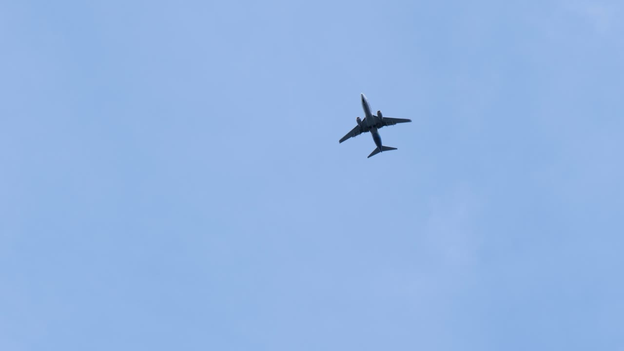 Commercial Airplane flying over Sitka, Alaska, United States of America.