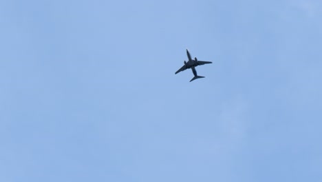 commercial airplane flying over sitka, alaska, united states of america.