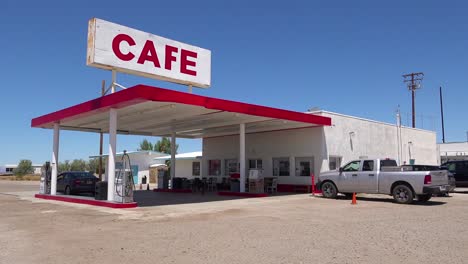 establishing shot of a lonely desert gas station and hotel motel cafe in the mojave desert 2