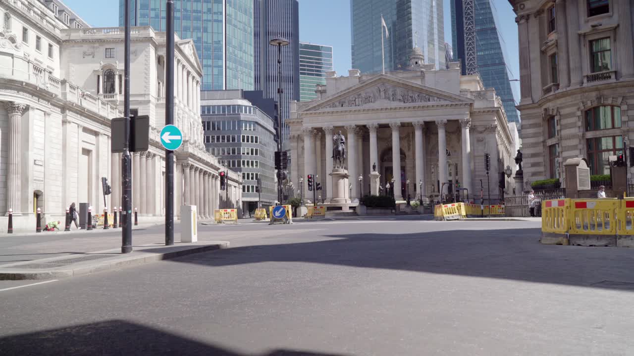 Due to corona virus outbreak and lockdown in London, there is no traffic or people on the street of busy central bank station and isolation is taking place firmly during a beautiful day