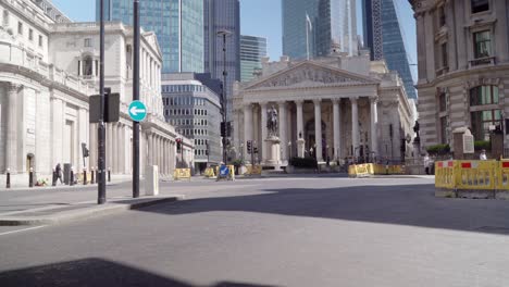 due to corona virus outbreak and lockdown in london, there is no traffic or people on the street of busy central bank station and isolation is taking place firmly during a beautiful day