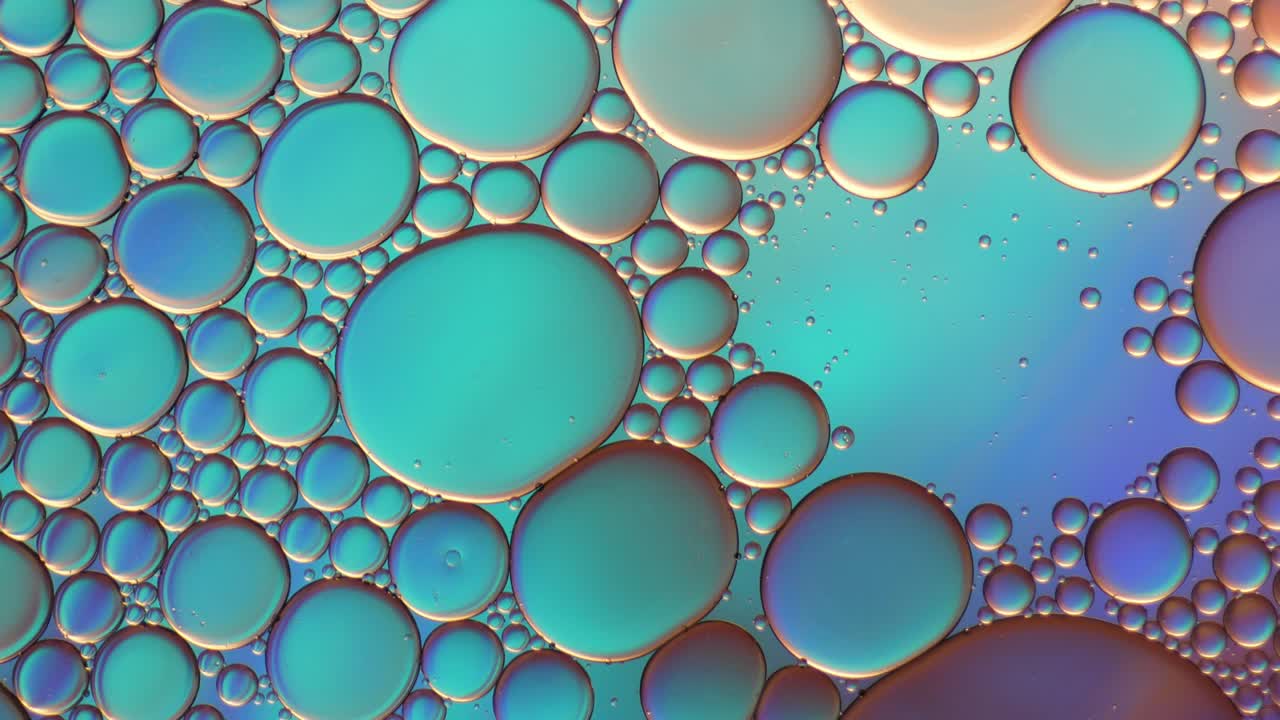 물 위에 떠다니는 기름방울의 다채로운 예술적. 추상적인 거품 배경