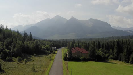 Wonderful-View-of-High-Tatras-in-Tatranska-Javorina-With-Beautiful-Trees-and-Cloudly-Sky-Above-in-Slovakia---Wide-Shot