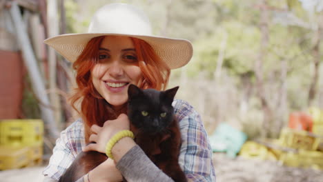 women holding her beloved black cat