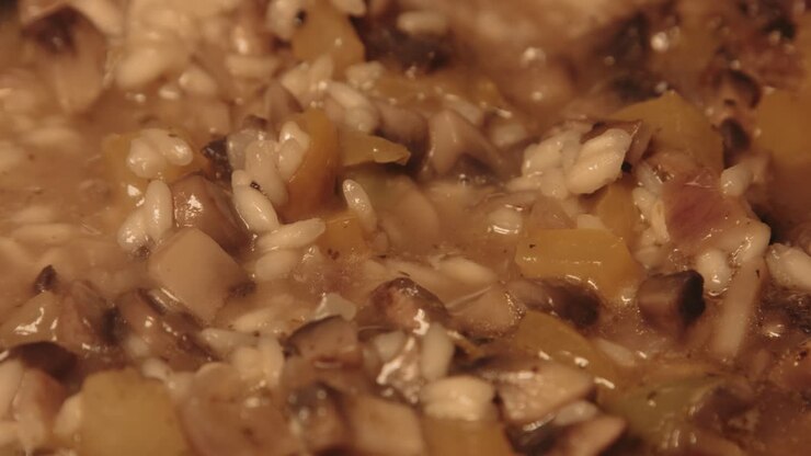 Close Up Pan of Italian Mushroom Risotto Cooking