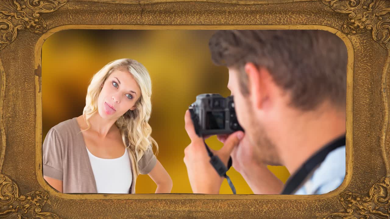 animación del cuadro sobre una pareja caucásica tomando una foto sobre un fondo negro