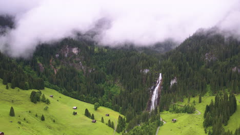 cinematic aerial shot circling right to left around iffigfall in the bernese oberland