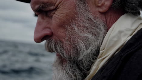 old sailor observing the stormy sea