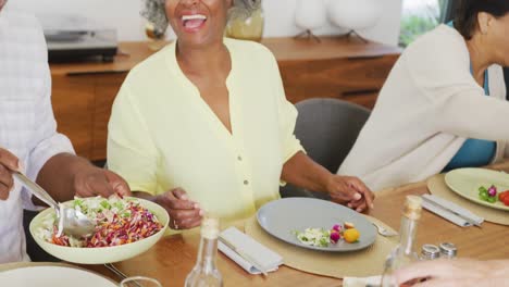 Happy-senior-diverse-people-having-dinner-at-retirement-home