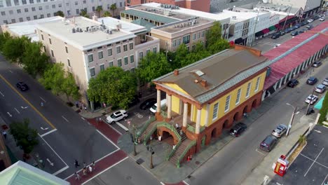 a drone shot orbiting market hall in downtown charleston, sc