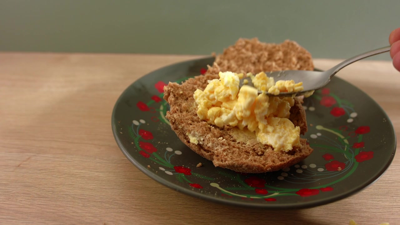 Making egg mayonnaise sandwich close up slow motion zoom shot selective focus