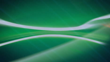 abstract green and blue light streaks animation over dark background