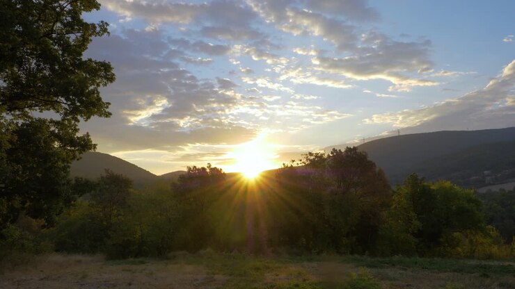Sunrise Over Provencal Countryside With Hills And Forest in slowmotion it's golden hour