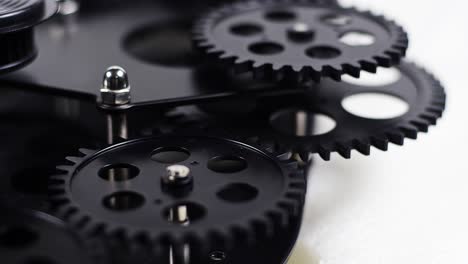 close up shot of black gear cogs rotating