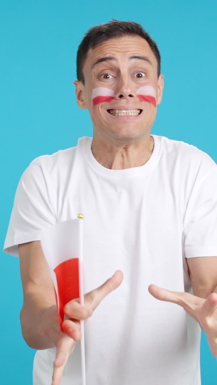 Man cheering for Poland during a match that is lost