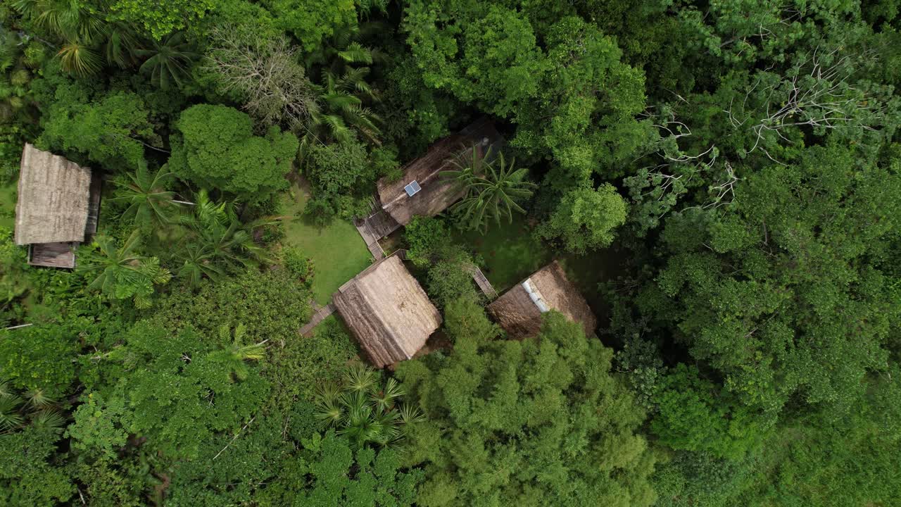 Top drone shot of indigenous village on the dense jungle, Amazon, Colombia
