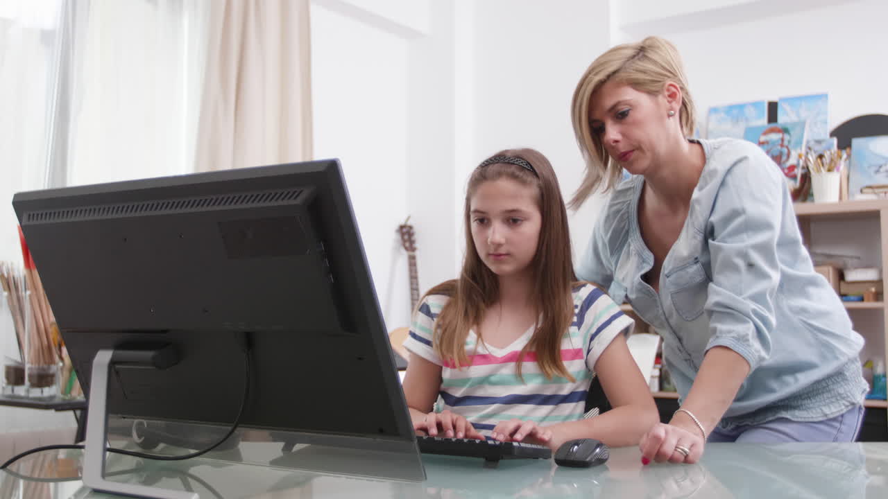 Woman and girl using a computer