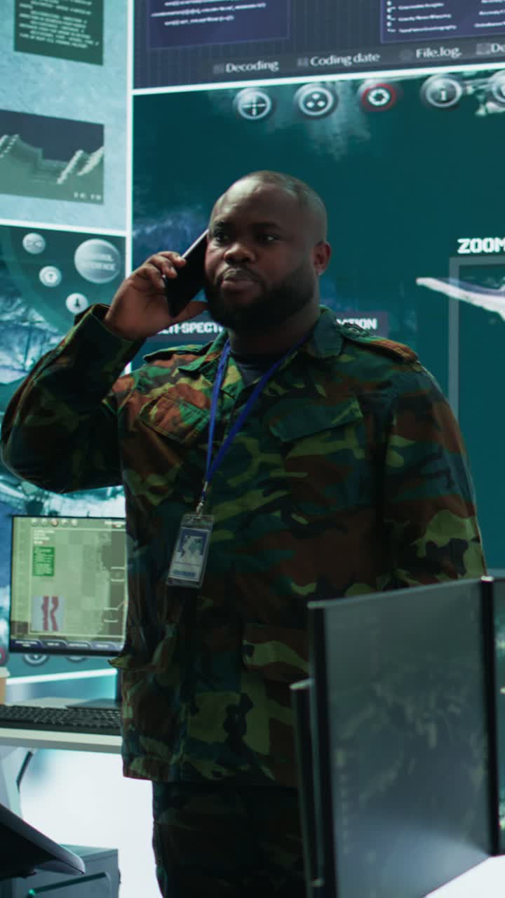 Vertical Video Military specialist handles national operations with his crew in control center