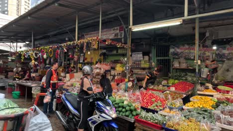 shoppers and vendors at a busy market