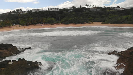 Mar-Chiquita-Beach-slow-motion-to-a-palm-tree-drone-1080p