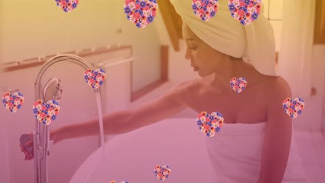animación de iconos de corazón sobre una mujer caucásica tomando un baño
