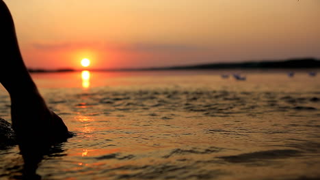 boy playing with paper boat. little boy playing with paper boat on water
