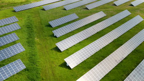 Stunning-aerial-view-of-solar-panels-on-green-field-in-Poland-close-up