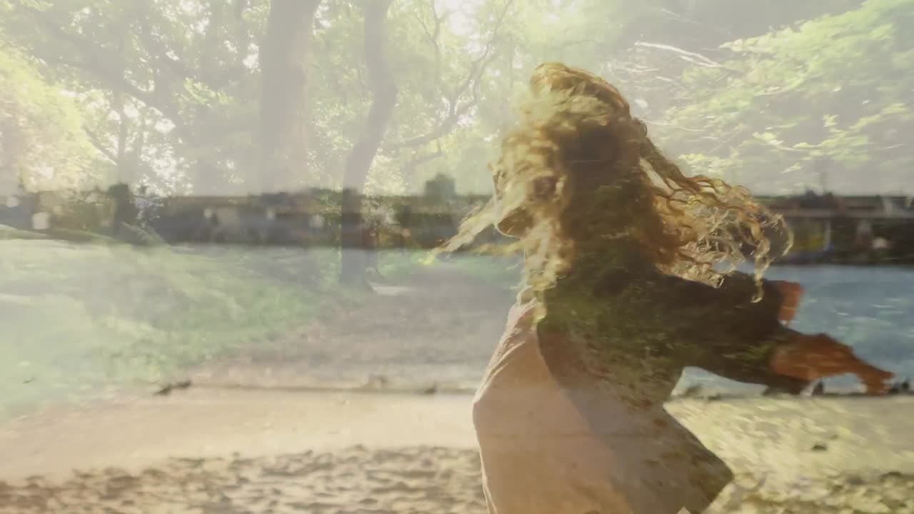 Woman spinning by the beach