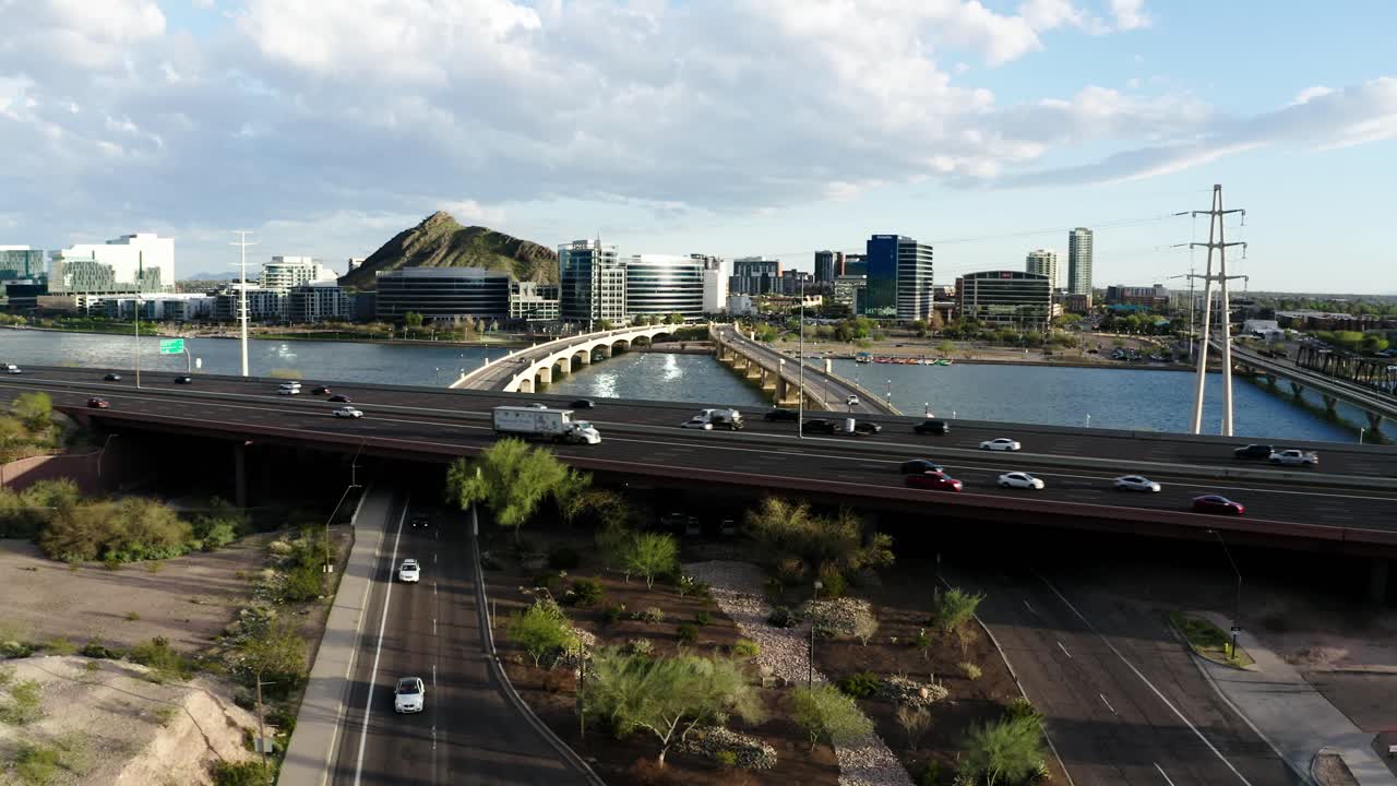 Drone shot of cars driving along Arizona's Red Mountain Freeway