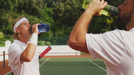 tennis players drinking water