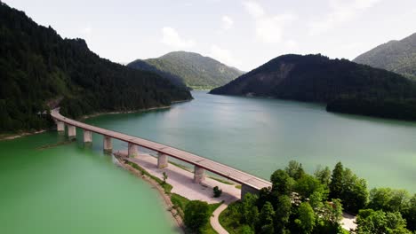 bridge over sylvenstein lake in germany - aerial drone shot