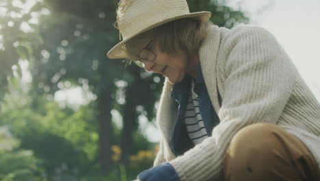 senior woman gardening in a sunlit garden