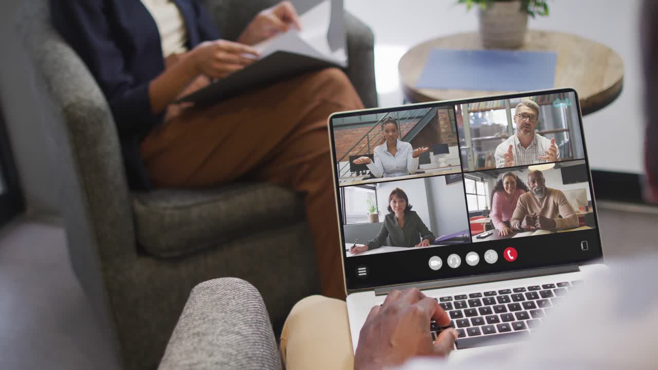 Animation of african american man having video call on laptop