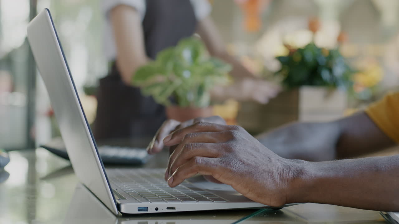 Person working on a laptop in a store