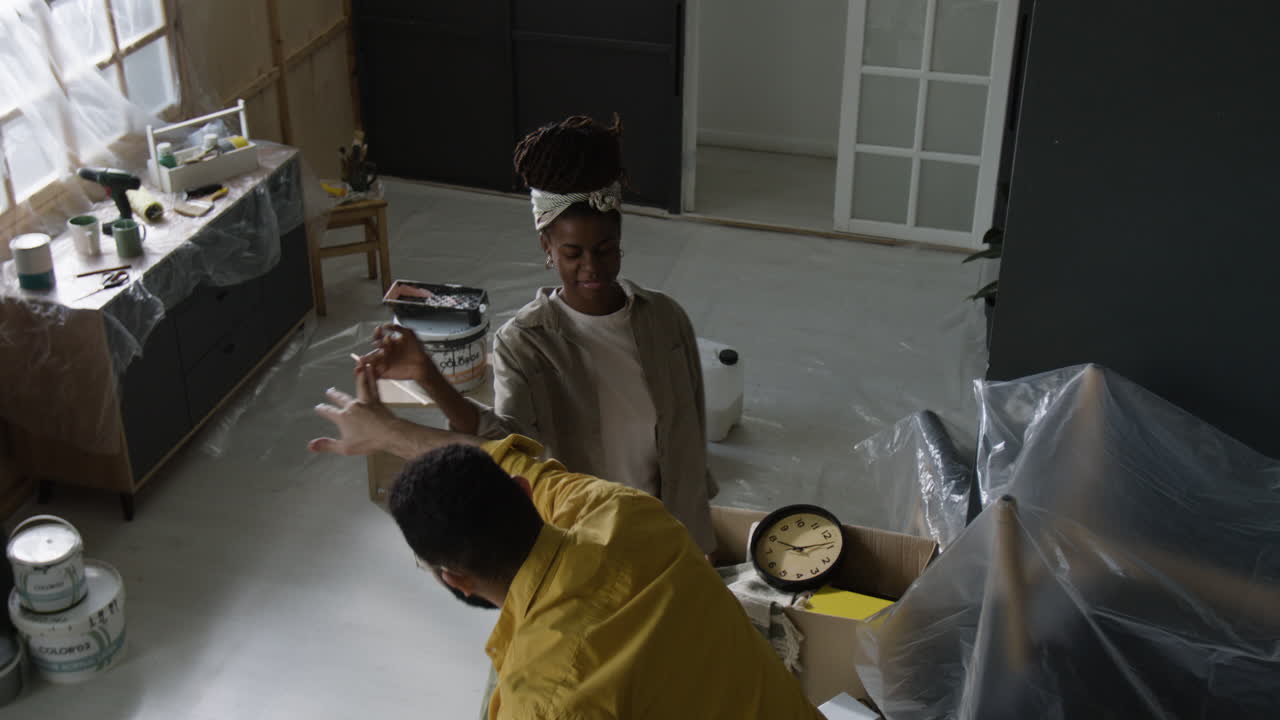 Couple renovating room together