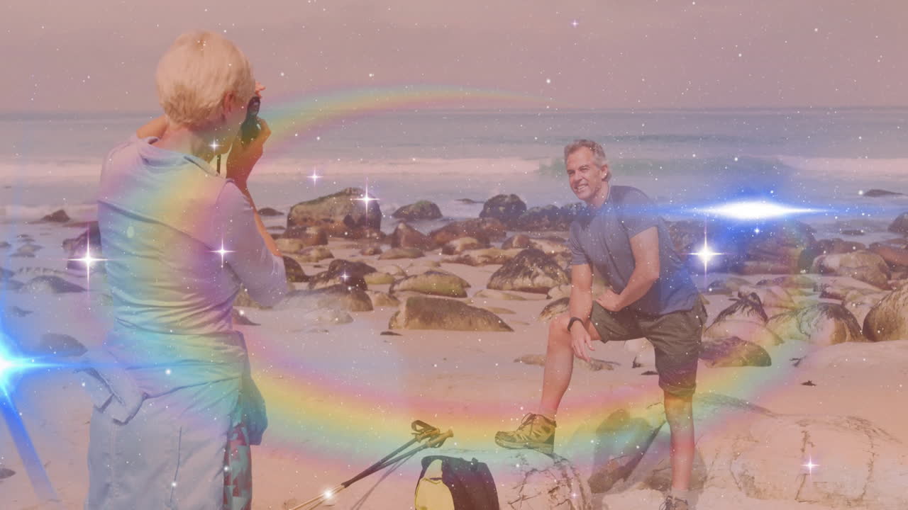 Woman photographer capturing man posing on rocky beach, with camera icon and travel graph overlays