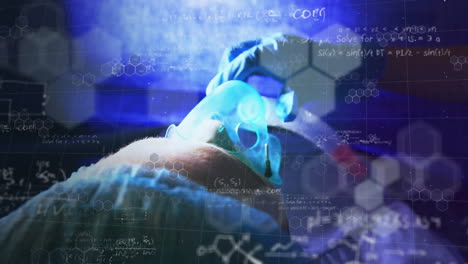 Animation od a patient with an osygen mask held by a surgeon over formulas in a blue background
