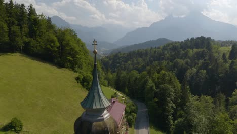 drone flies over the pilgrimage church of maria gern on beautiful summer afternoon