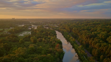 summertime drone footage with a slow flight above the huron river in ann arbor, michigan.