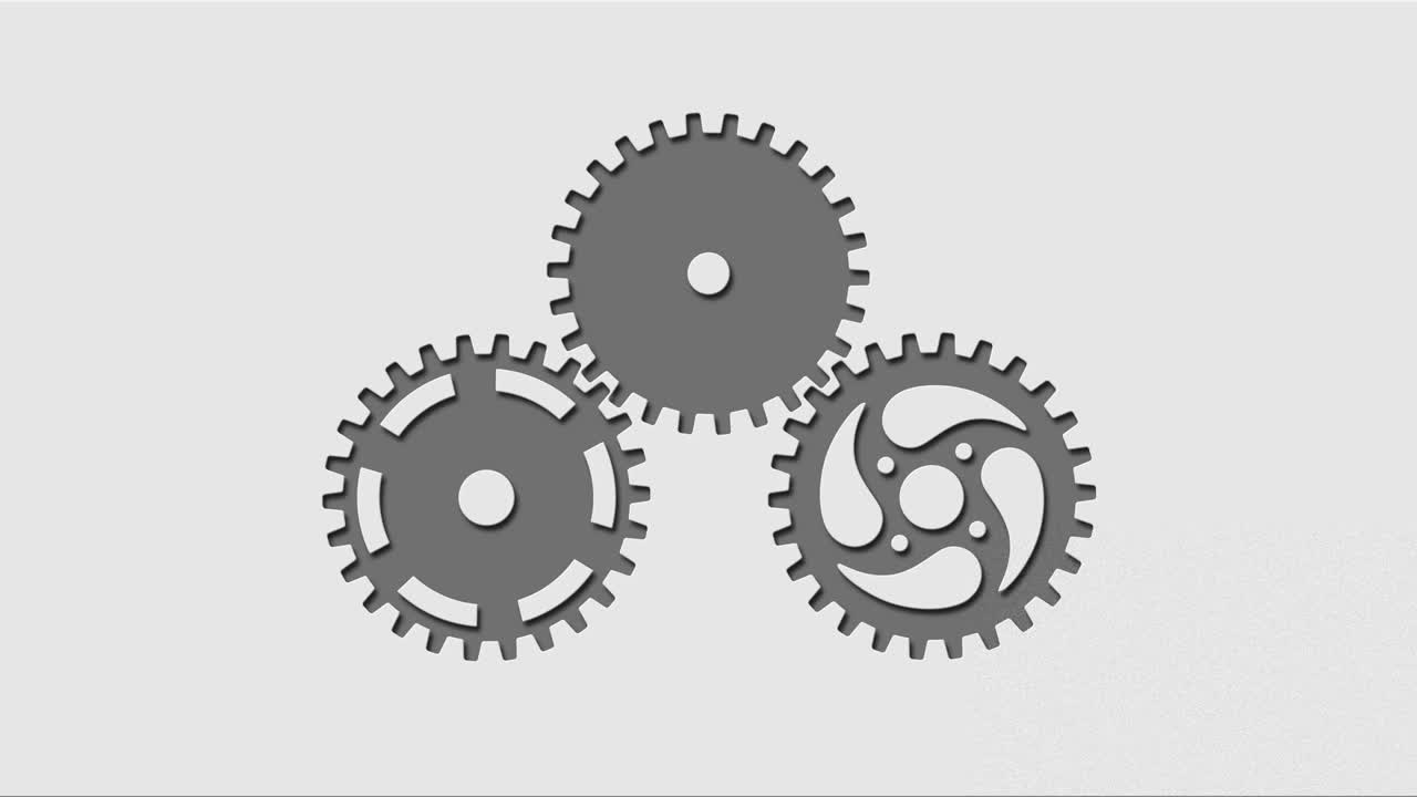 tres engranajes giratorios cortados en un fondo gris claro