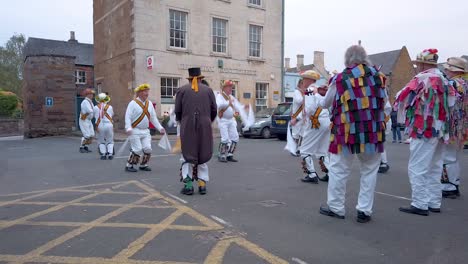 uppingham market town hosting the rutland morris men to the market square to provide traditional folk dancing and music. uppingham is in the smallest county of rutland in england, great britain.