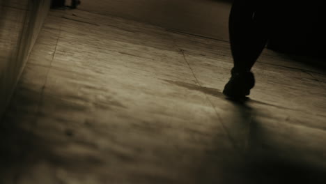 slow motion feet close up of young girl walking alone in dark hallway road street